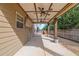 Cozy covered back porch featuring ceiling fans and open-air lounge space at 511 Wagon Hill Ln, Sugar Hill, GA 30518