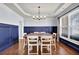 Elegant dining area features a stylish table set and decorative lighting fixture at 511 Wagon Hill Ln, Sugar Hill, GA 30518