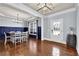 Formal dining area with paneled walls and stylish barrel decor at 511 Wagon Hill Ln, Sugar Hill, GA 30518