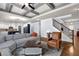 Open-concept living room featuring coffered ceiling and hardwood flooring at 511 Wagon Hill Ln, Sugar Hill, GA 30518