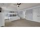 Bright main bedroom with neutral-colored walls, tray ceilings, and direct access to a private bathroom at 511 Wagon Hill Ln, Sugar Hill, GA 30518