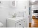 Bathroom featuring white vanity, faucet, medicine cabinet, tiled walls, and neutral decor at 841 Frederica Ne St # 19, Atlanta, GA 30306