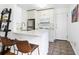 Modern kitchenette with stainless steel appliances and breakfast bar seating at 841 Frederica Ne St # 19, Atlanta, GA 30306