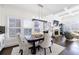 Well-lit dining room with stylish furniture and views of the fireplace and living area at 2298 Grady Ridge Dr, Duluth, GA 30097