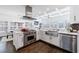 Stylish kitchen features a stainless steel range, large island sink, and abundant natural light at 2298 Grady Ridge Dr, Duluth, GA 30097