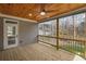 Inviting covered back porch with wood ceiling, fan, and railing overlooking the backyard at 331 Terrell Sw Dr, Marietta, GA 30064