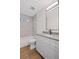 A bathroom featuring a single sink vanity, a modern faucet, a tub, and a tile wall at 331 Terrell Sw Dr, Marietta, GA 30064