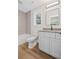 A bathroom featuring a single sink vanity, a modern faucet, a tub, and a tile wall at 331 Terrell Sw Dr, Marietta, GA 30064