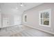 A bedroom with neutral colored carpet, two windows that provide natural light, and a closet for storage at 331 Terrell Sw Dr, Marietta, GA 30064