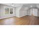 Bedroom featuring hardwood flooring, base molding, white walls, and a window overlooking the lawn at 331 Terrell Sw Dr, Marietta, GA 30064