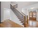 Entryway with hardwood floors, staircase, and double front doors allowing natural light at 331 Terrell Sw Dr, Marietta, GA 30064