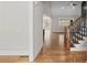 Light and airy entryway featuring hardwood floors and a staircase with black iron railing at 331 Terrell Sw Dr, Marietta, GA 30064