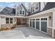 Charming home featuring board and batten siding, brick accents, a two-car garage, and a concrete driveway at 331 Terrell Sw Dr, Marietta, GA 30064
