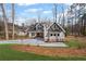 A beautiful two-story home with a well-manicured lawn and a long, freshly paved driveway at 331 Terrell Sw Dr, Marietta, GA 30064
