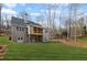 Spacious backyard featuring a two-story house with an outdoor balcony overlooking the lawn at 331 Terrell Sw Dr, Marietta, GA 30064