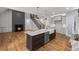 Modern kitchen with island, stainless steel appliances, farmhouse sink, and hardwood floors at 331 Terrell Sw Dr, Marietta, GA 30064