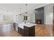 Modern kitchen with island, stainless steel appliances, farmhouse sink, and hardwood floors at 331 Terrell Sw Dr, Marietta, GA 30064