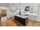 Modern kitchen with stainless steel appliances, custom cabinets, island, and hardwood floors at 331 Terrell Sw Dr, Marietta, GA 30064