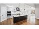 Modern kitchen with stainless steel appliances, custom cabinets, island, and hardwood floors at 331 Terrell Sw Dr, Marietta, GA 30064