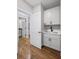 Well-lit mudroom features built-in cabinets, sink, and a doorway with hardwood floors at 331 Terrell Sw Dr, Marietta, GA 30064