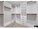 A walk-in closet featuring built-in shelving, hanging rods, drawers, and ample storage space for organization at 331 Terrell Sw Dr, Marietta, GA 30064