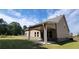 Back of the house with covered back porch, windows, and well-maintained lawn at 3828 Southfield Ct, Loganville, GA 30052
