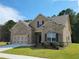 Beautiful brick and siding home with well-manicured lawn, attached two car garage and beautiful landscaping at 3828 Southfield Ct, Loganville, GA 30052