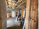 This unfinished basement shows construction materials, utilities and a concrete floor at 770 Prickett Rd, Douglasville, GA 30134