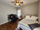 This cozy bedroom includes a ceiling fan, hardwood floors and a dedicated desk and workspace at 770 Prickett Rd, Douglasville, GA 30134