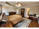Spacious main bedroom featuring hardwood floors, tray ceilings, sitting area and ensuite bathroom at 770 Prickett Rd, Douglasville, GA 30134