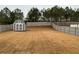 Large backyard with a gray shed and wooden fence at 140 Craines Vw, Covington, GA 30014