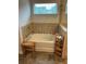 Inviting bathroom with a soaking tub, neutral tile, and relaxing decor at 140 Craines Vw, Covington, GA 30014