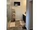 Bathroom with tiled floors, glass shower, and a wall-mounted television at 140 Craines Vw, Covington, GA 30014