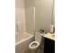 Clean bathroom with a tub, toilet, and vanity with modern fixtures and neutral tones at 140 Craines Vw, Covington, GA 30014