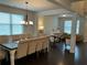 Elegant dining room with hardwood floors, chandelier, and ample seating for Gathering and guests at 140 Craines Vw, Covington, GA 30014