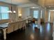 Elegant dining room featuring hardwood floors, neutral walls, and modern furnishings at 140 Craines Vw, Covington, GA 30014