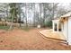 An expansive backyard features a wooden deck, storage building, and a wood privacy fence at 2466 Sharondale Ne Dr, Atlanta, GA 30305