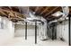 Spacious basement with ductwork, beams, and white flooring perfect for future finishing at 2466 Sharondale Ne Dr, Atlanta, GA 30305