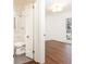 Hallway view to full bathroom with tiled shower and bedroom with hardwood floors at 2466 Sharondale Ne Dr, Atlanta, GA 30305