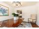 The dining room shows off crown molding, a chandelier, wood floors, and a table with an accent rug at 2466 Sharondale Ne Dr, Atlanta, GA 30305