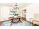 Elegant dining room featuring a wood table, stylish chandelier, and hardwood floors at 2466 Sharondale Ne Dr, Atlanta, GA 30305