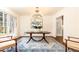 Bright dining room featuring a statement chandelier, large windows, and comfortable seating at 2466 Sharondale Ne Dr, Atlanta, GA 30305