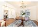 Bright dining room with stylish chandelier, hardwood flooring, and views into living spaces at 2466 Sharondale Ne Dr, Atlanta, GA 30305