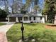 Charming one-story home with a convenient carport and beautifully maintained lawn at 2466 Sharondale Ne Dr, Atlanta, GA 30305