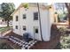 Rear exterior of home showing brick, windows, stone walkway and HVAC unit at 2466 Sharondale Ne Dr, Atlanta, GA 30305