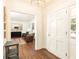 Welcoming foyer with hardwood floors, a view into the living room, and a freshly painted door at 2466 Sharondale Ne Dr, Atlanta, GA 30305