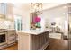 Beautiful kitchen with marble countertop island and open view to the living room at 2466 Sharondale Ne Dr, Atlanta, GA 30305