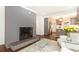 Open-concept living room flowing into the kitchen with hardwood floors and fireplace at 2466 Sharondale Ne Dr, Atlanta, GA 30305