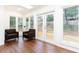 Bright sunroom with hardwood floors, lots of windows, and access to outdoor deck at 2466 Sharondale Ne Dr, Atlanta, GA 30305