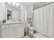 Bright bathroom offers a sleek vanity, modern fixtures, and a shower with a tile surround at 43 N Auburn Landing Pl, Auburn, GA 30011